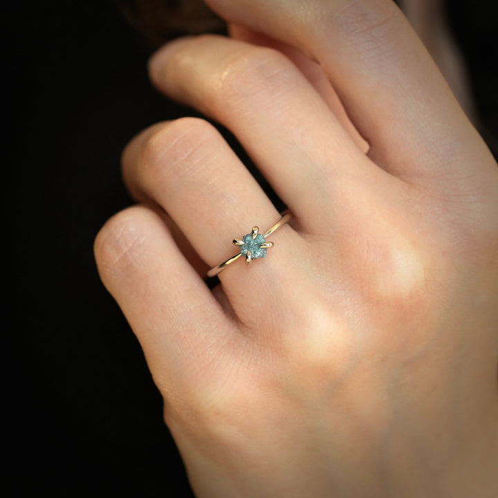 Yellow gold ring with raw blue diamond