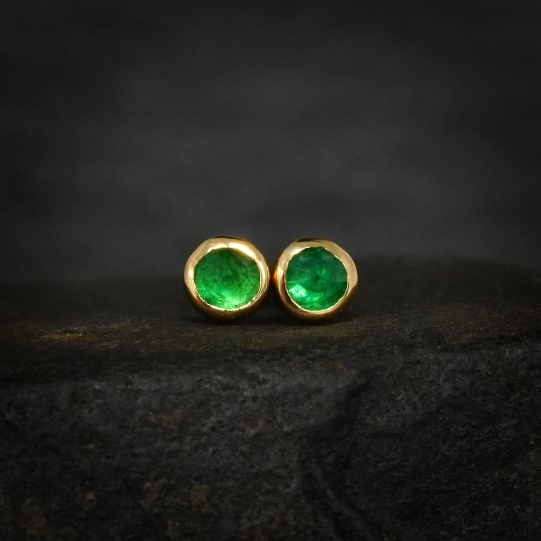 Yellow gold stud earrings with natural green emeralds