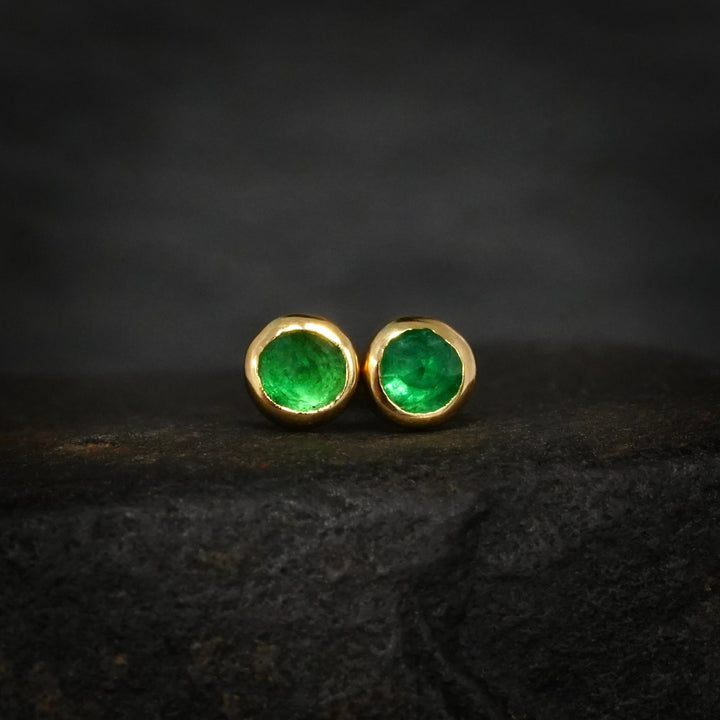 Yellow gold stud earrings with natural green emeralds