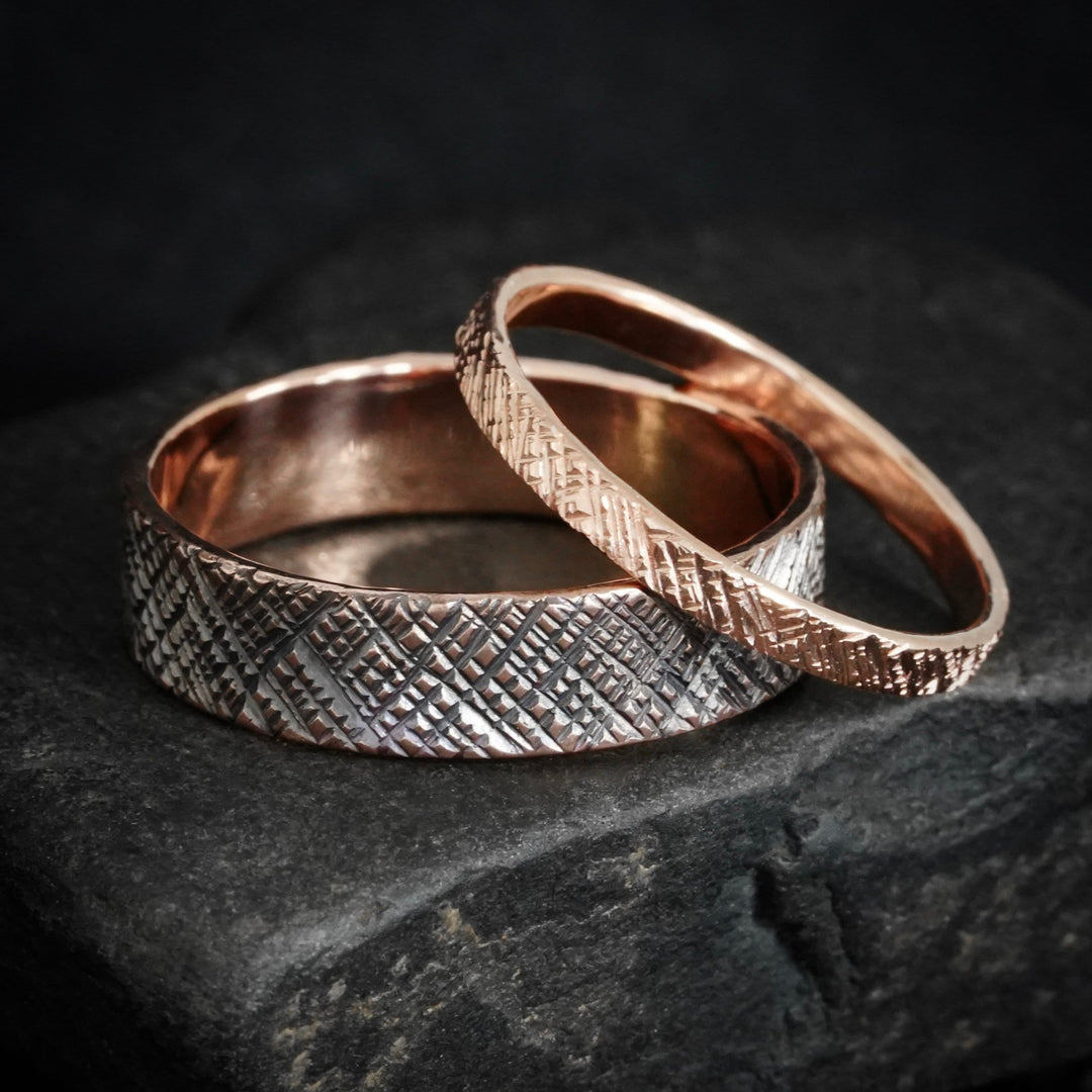 Set of rose gold wedding rings with criss-cross pattern