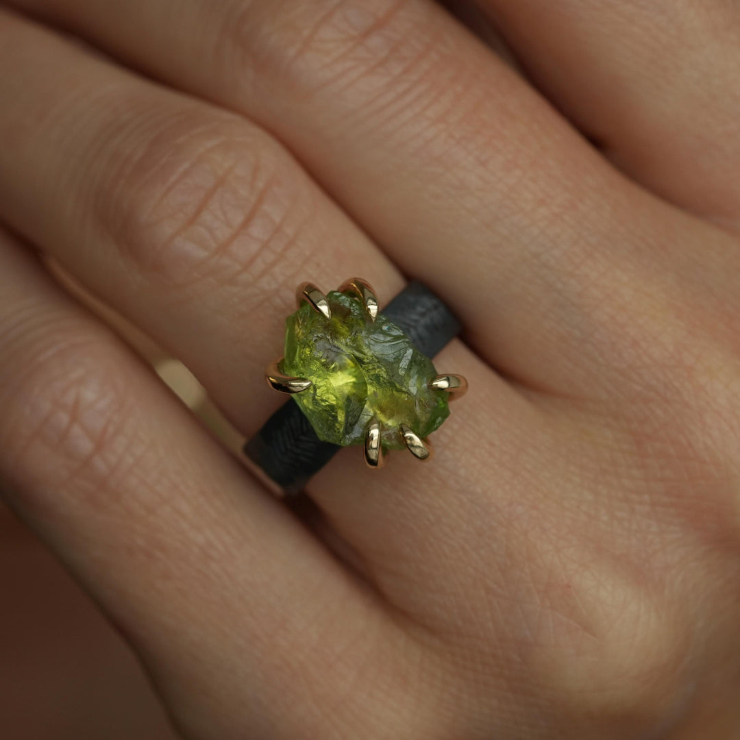 Raw Peridot Ring. Rustic Mixed Metal Gold and Black Silver Prong Set Raw Uncut Natural Peridot Statement Large Stone Feather Rebel Ring