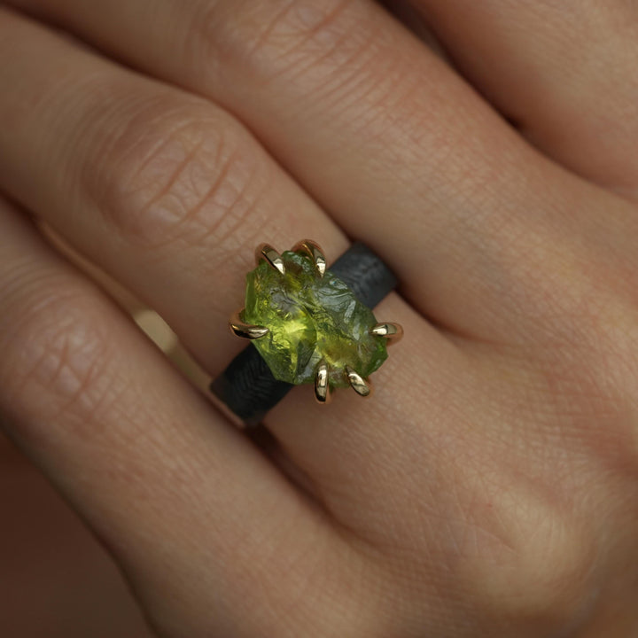 Raw Peridot Ring. Rustic Mixed Metal Gold and Black Silver Prong Set Raw Uncut Natural Peridot Statement Large Stone Feather Rebel Ring