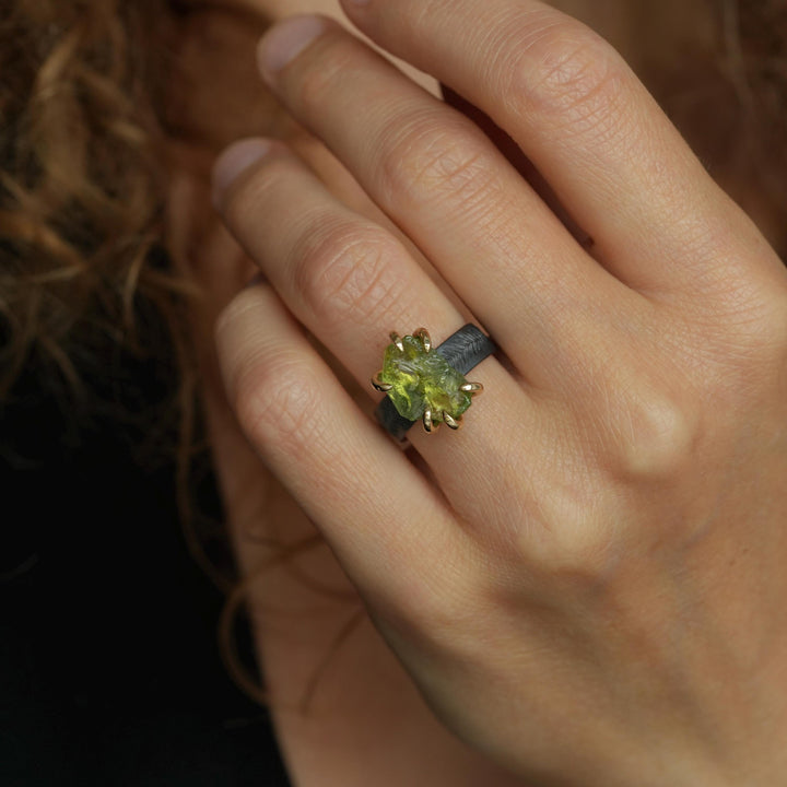 Raw Peridot Ring. Rustic Mixed Metal Gold and Black Silver Prong Set Raw Uncut Natural Peridot Statement Large Stone Feather Rebel Ring
