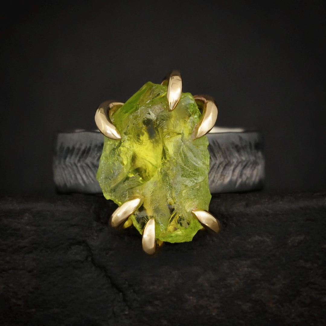 Raw Peridot Ring. Rustic Mixed Metal Gold and Black Silver Prong Set Raw Uncut Natural Peridot Statement Large Stone Feather Rebel Ring