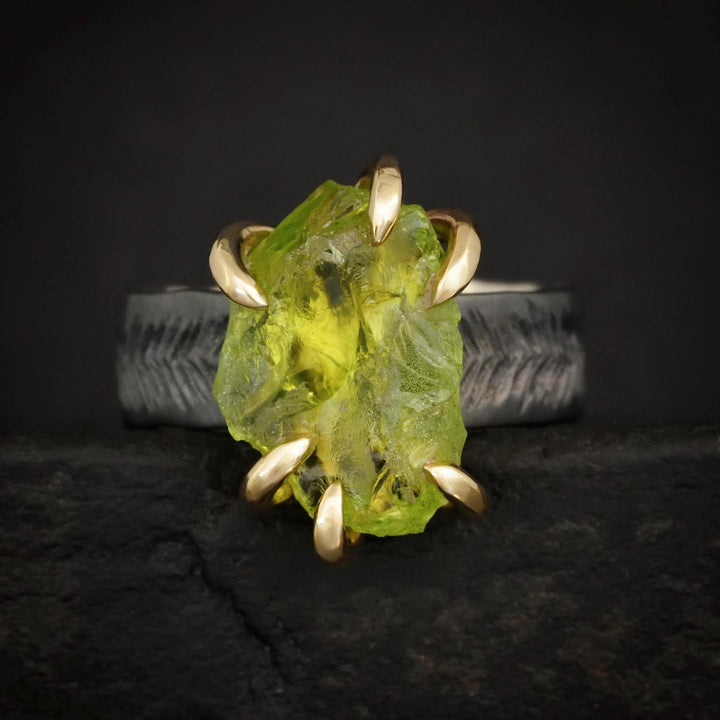 Raw Peridot Ring. Rustic Mixed Metal Gold and Black Silver Prong Set Raw Uncut Natural Peridot Statement Large Stone Feather Rebel Ring