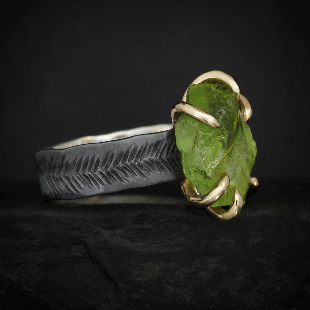 Raw Peridot Ring. Rustic Mixed Metal Gold and Black Silver Prong Set Raw Uncut Natural Peridot Statement Large Stone Feather Rebel Ring