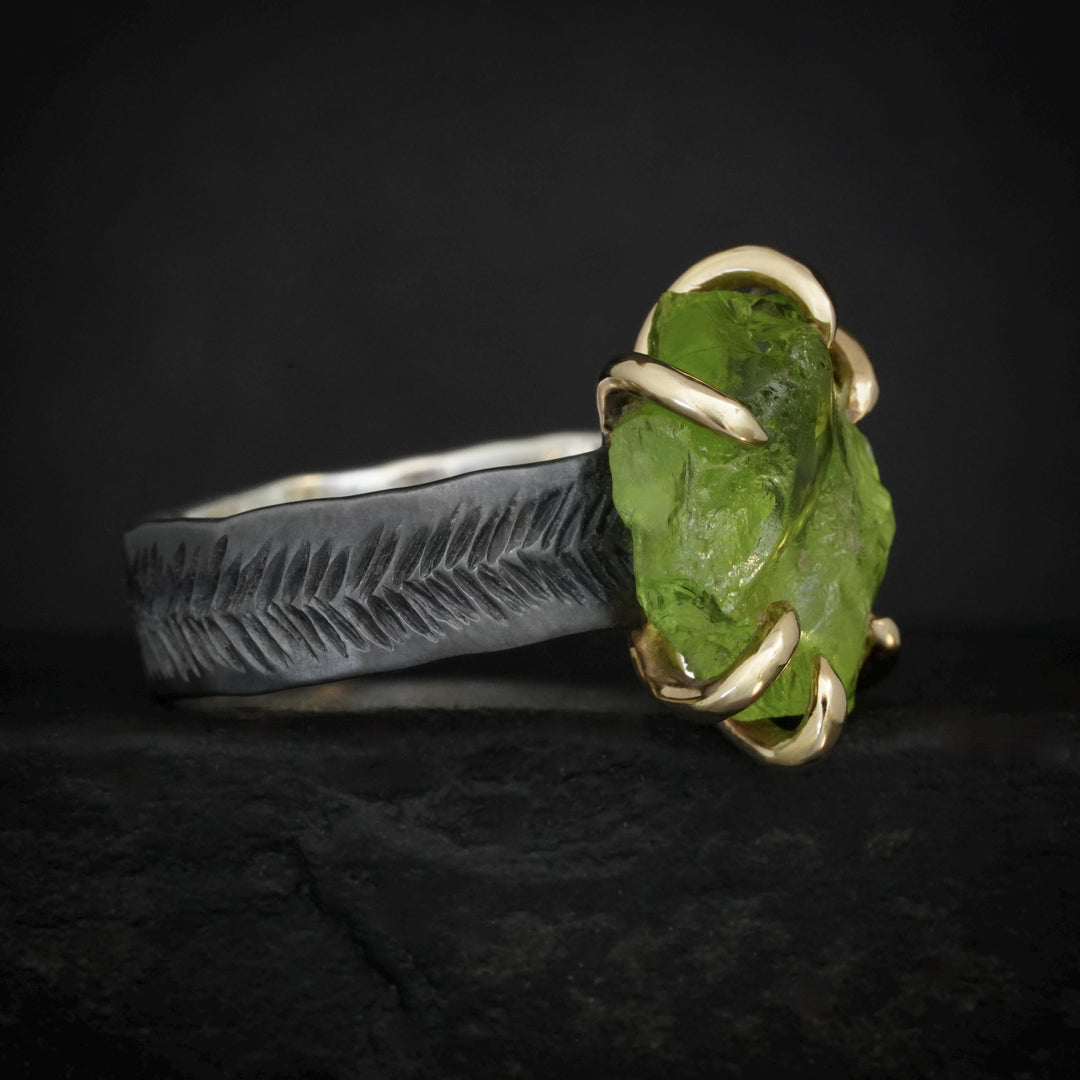 Raw Peridot Ring. Rustic Mixed Metal Gold and Black Silver Prong Set Raw Uncut Natural Peridot Statement Large Stone Feather Rebel Ring